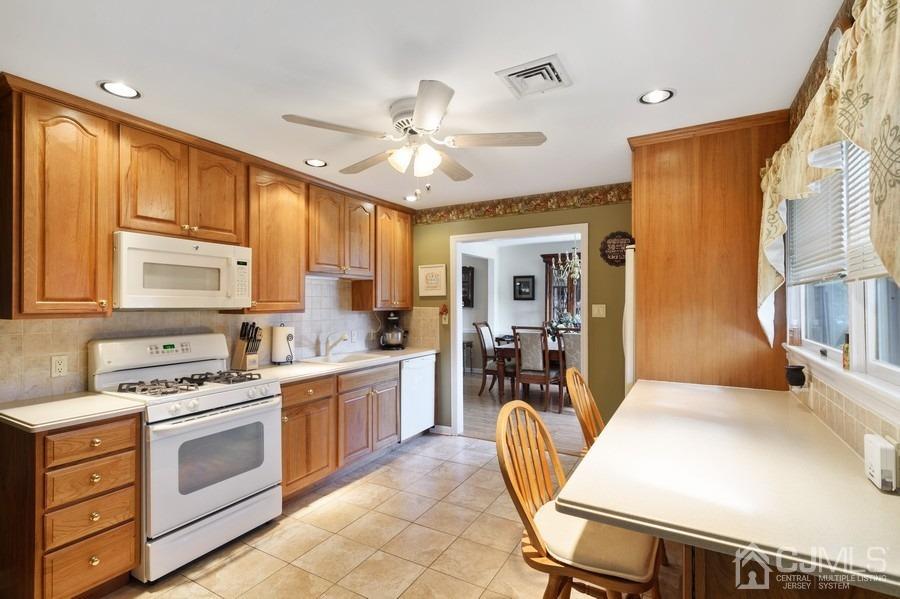 46 Weldon Road Edison, NJ 08817 - Photo 4 of 18 a kitchen with a stove a sink and a refrigerator