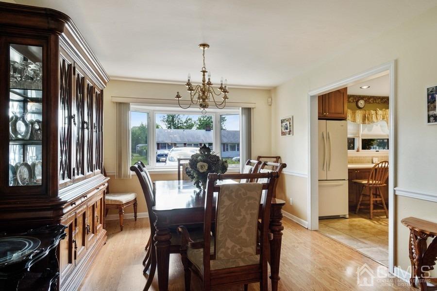46 Weldon Road Edison, NJ 08817 - Photo 5 of 18 a view of a dining room with furniture window and wooden floor