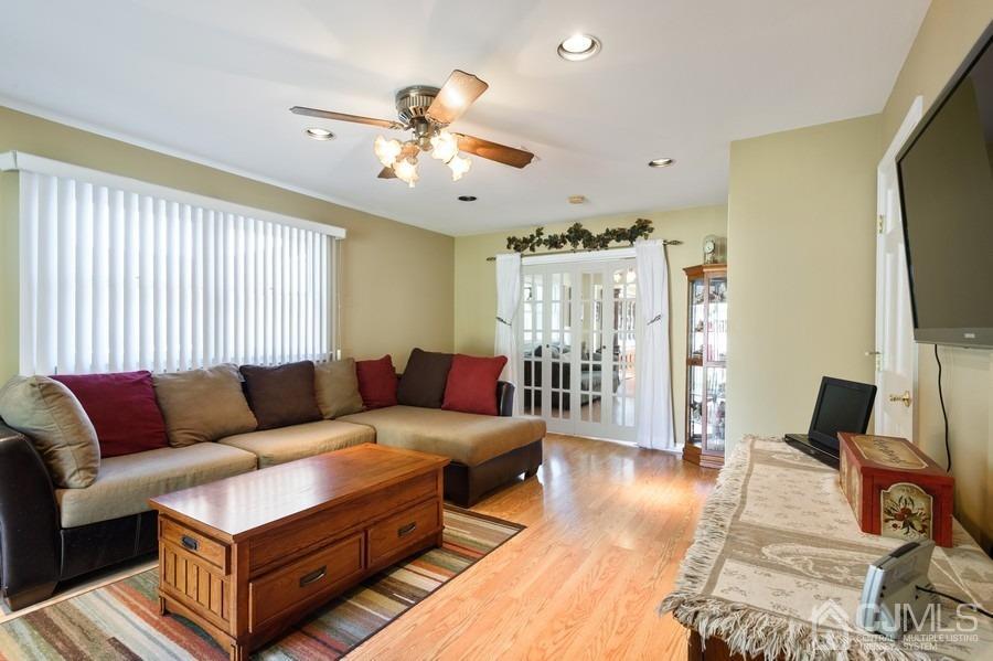 46 Weldon Road Edison, NJ 08817 - Photo 9 of 18 a living room with furniture and a flat screen tv