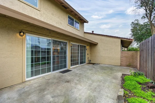 a view of backyard with trampoline