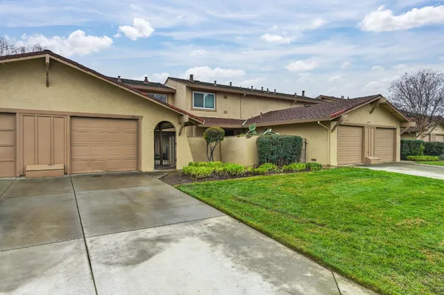 a swimming pool with outdoor seating and yard