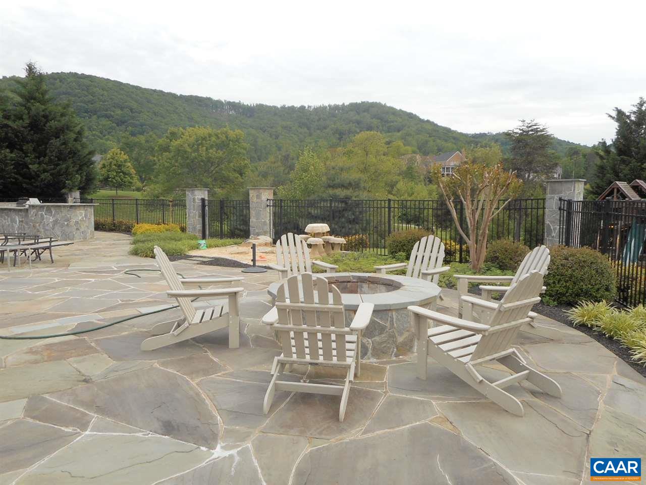 520 Rocks Farm Drive Charlottesville, VA 22903 - Photo 11 of 50 a view of a patio with a table and chairs and couches