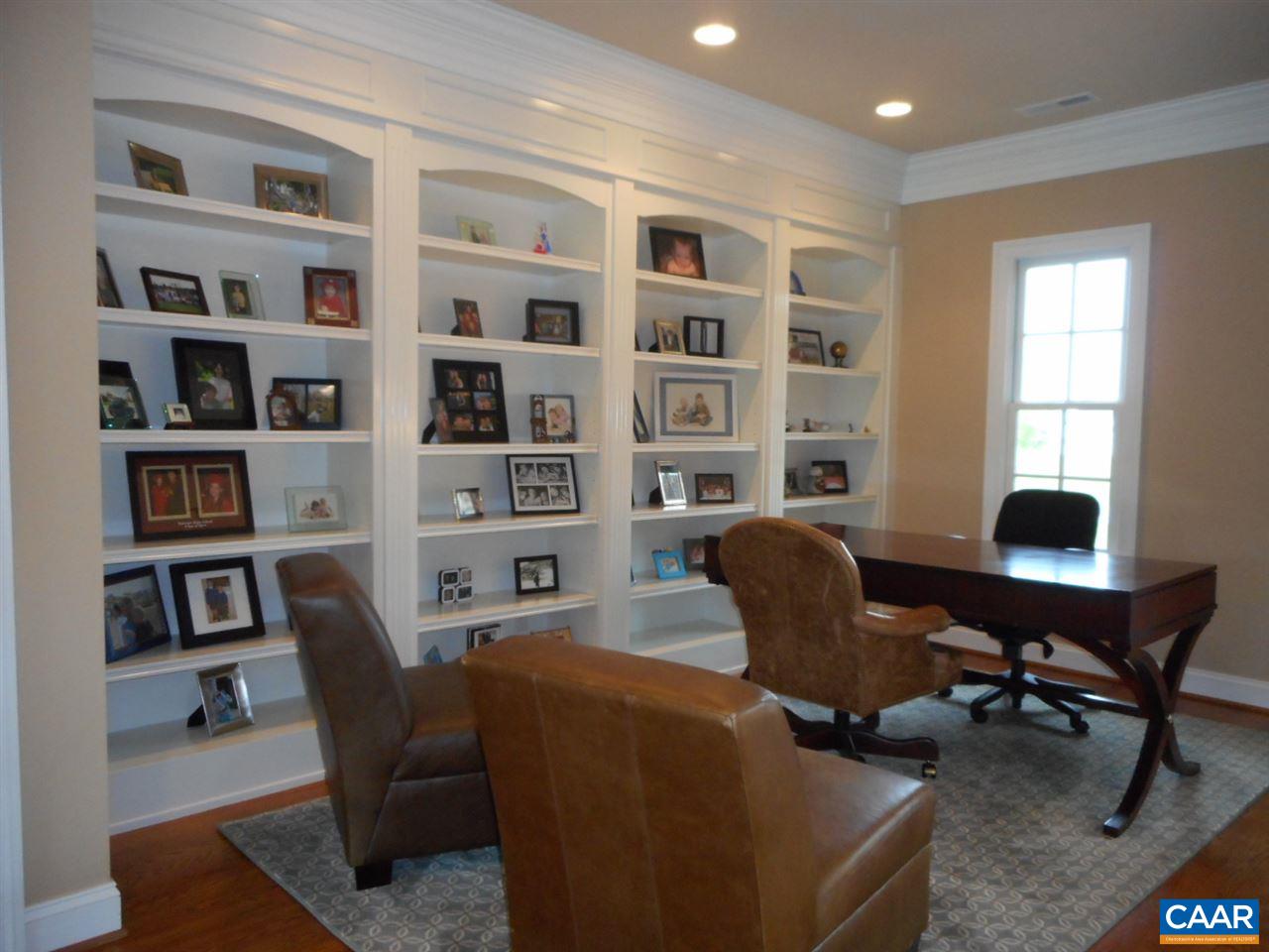 520 Rocks Farm Drive Charlottesville, VA 22903 - Photo 30 of 50 a view of a workspace with furniture and a bookshelf