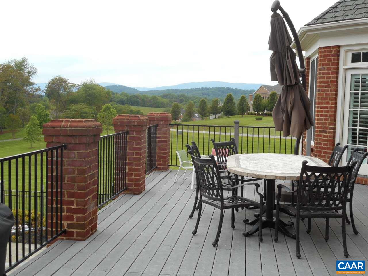 520 Rocks Farm Drive Charlottesville, VA 22903 - Photo 3 of 50 a view of a roof deck with table and chairs