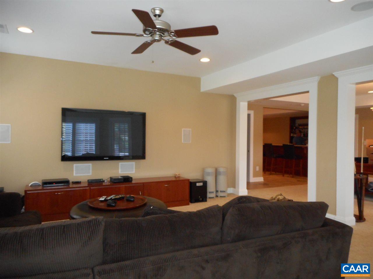 520 Rocks Farm Drive Charlottesville, VA 22903 - Photo 38 of 50 a living room with furniture and a flat screen tv