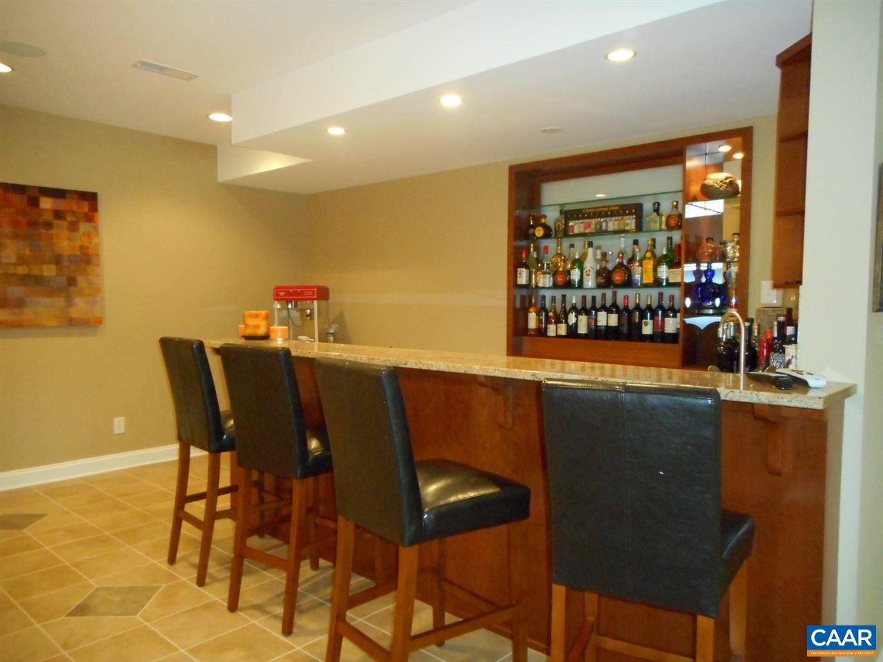 520 Rocks Farm Drive Charlottesville, VA 22903 - Photo 40 of 50 a dining room with furniture and a floor to ceiling window