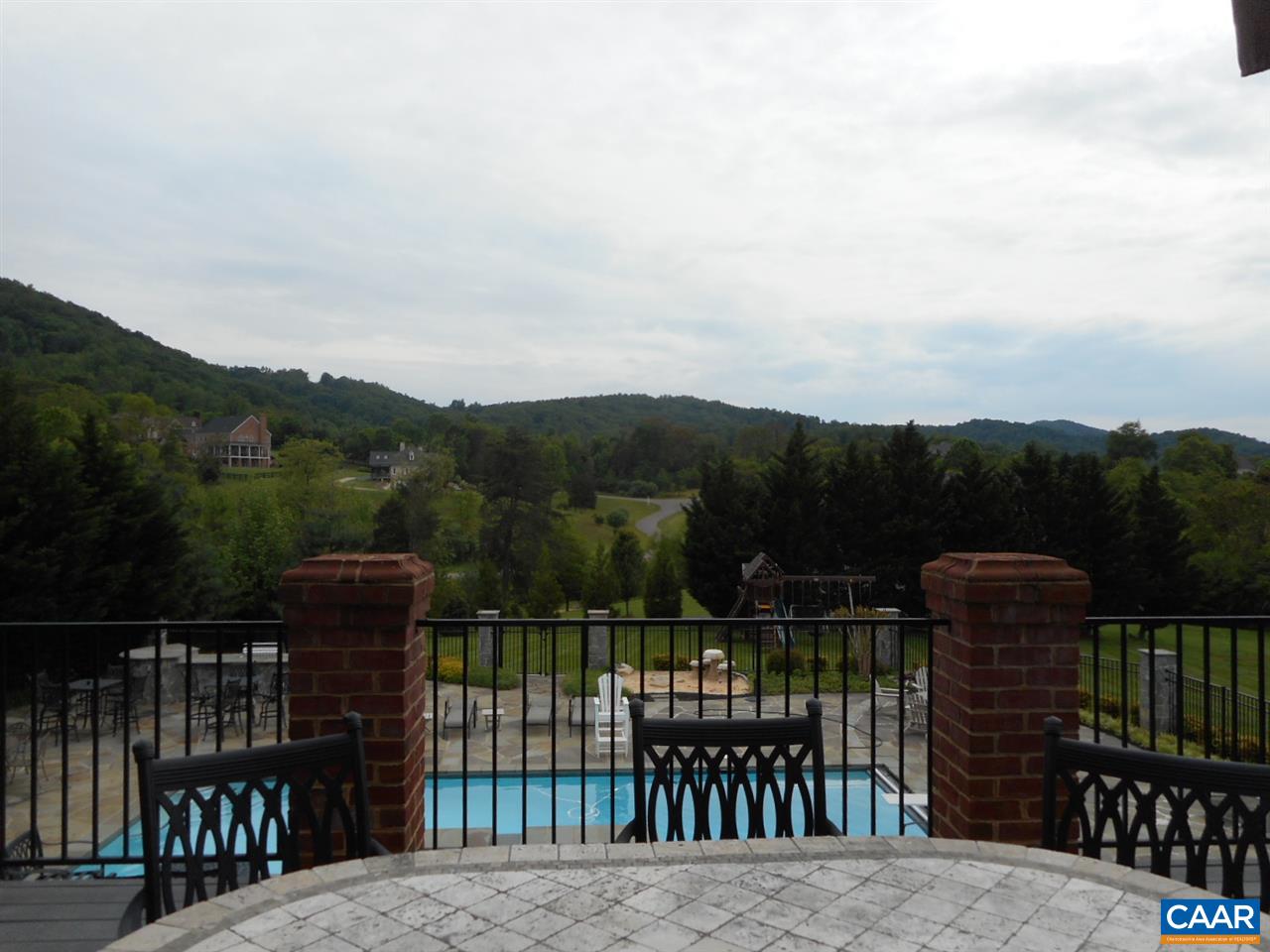 520 Rocks Farm Drive Charlottesville, VA 22903 - Photo 4 of 50 a view of a dinning table and chairs on the roof deck