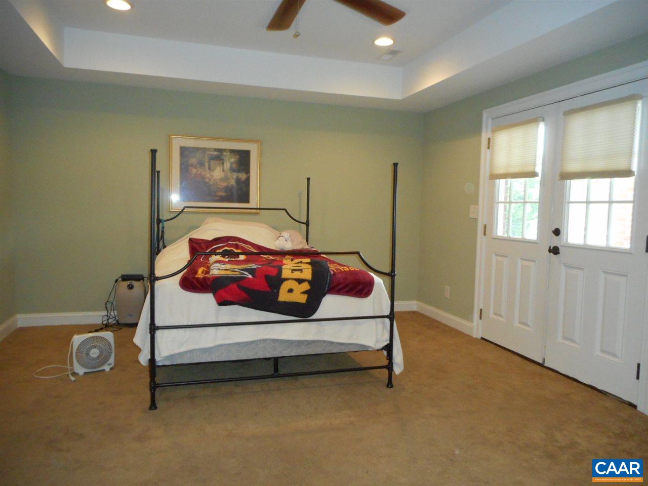 520 Rocks Farm Drive Charlottesville, VA 22903 - Photo 45 of 50 a bedroom with a bed and a lamp
