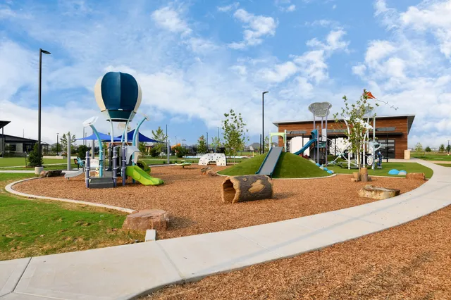 a view of a park with swings