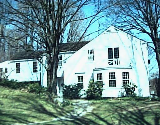 36 Pond Brook Road Newtown, CT 06470 - Photo 1 of 1 a front view of a house with a yard