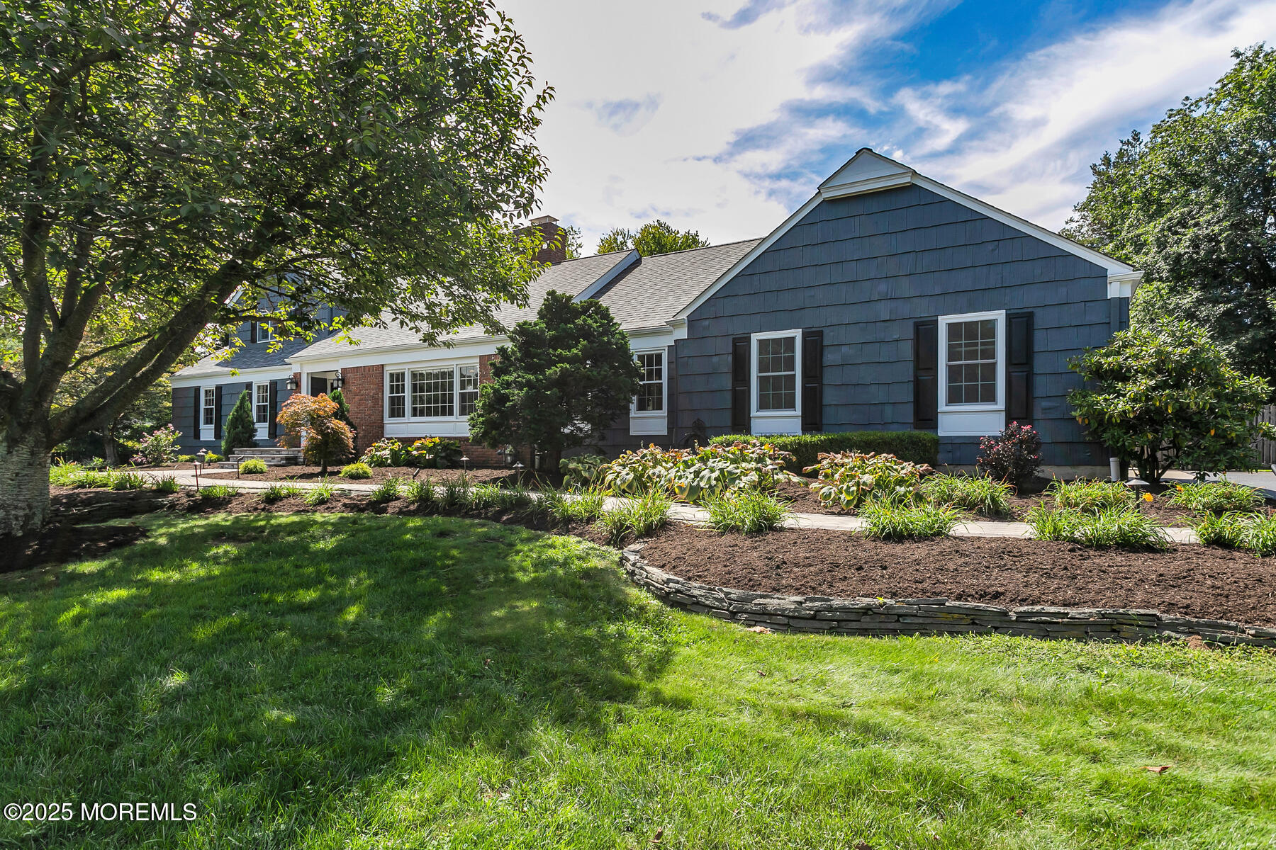 11 Saddle Ridge Road Colts Neck, NJ 07722 - Photo 1 of 63 a front view of house with yard and green space