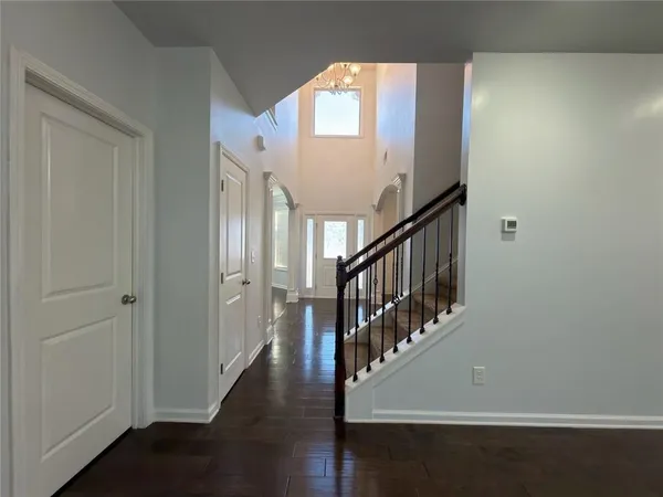 a view of an entryway with wooden floor