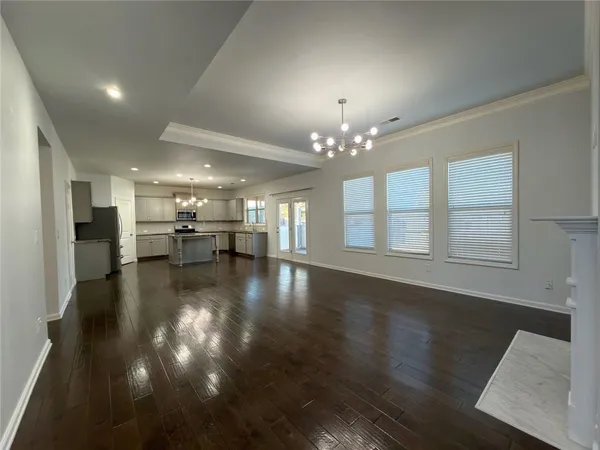 a view of a room with lots of wooden furniture