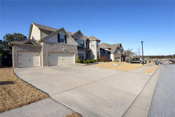 a view of multiple houses with a road