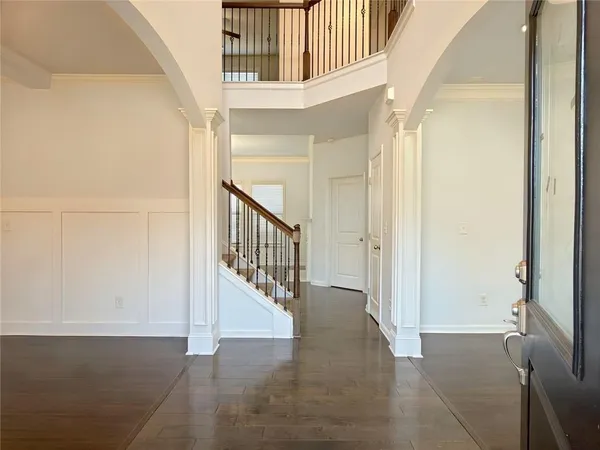 a view of staircase with white walls and a window