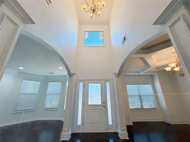 a view of an entryway with wooden floor