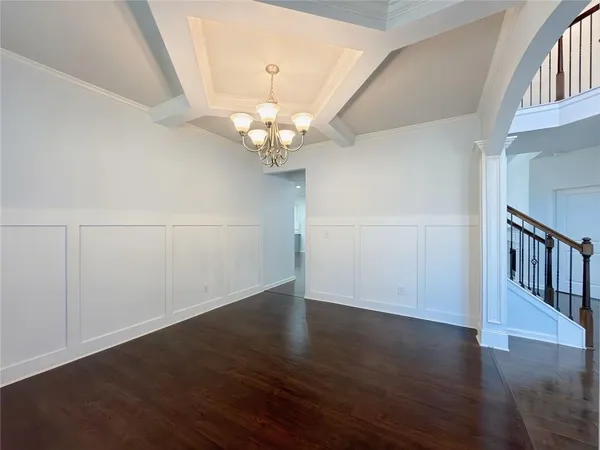 an empty room with wooden floor