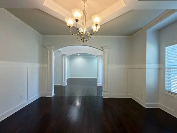 a view of a livingroom with wooden floor