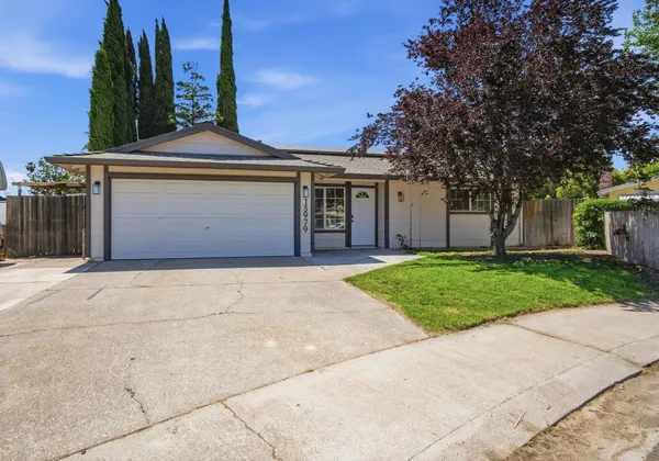 front view of a house with a garden