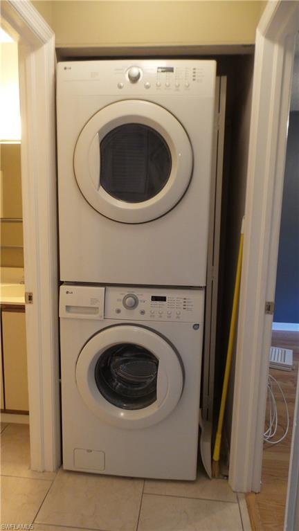 5327 Treetops Drive, Unit T205 Naples, FL 34113 - Photo 10 of 18 a utility room with dryer and washer