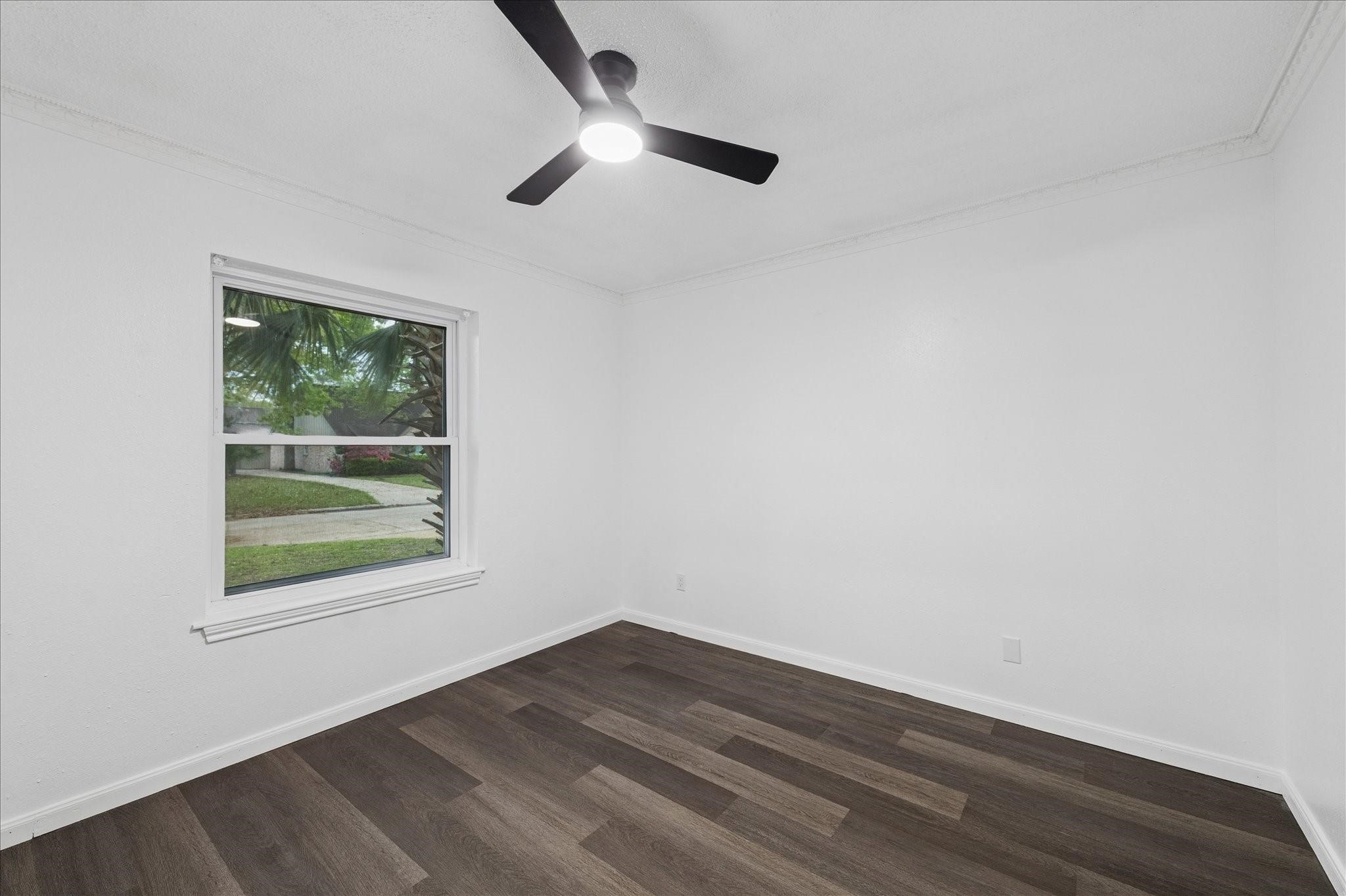 210 Weeping Oak Lane Spring, TX 77388 - Photo 15 of 20 an empty room with wooden floor and windows