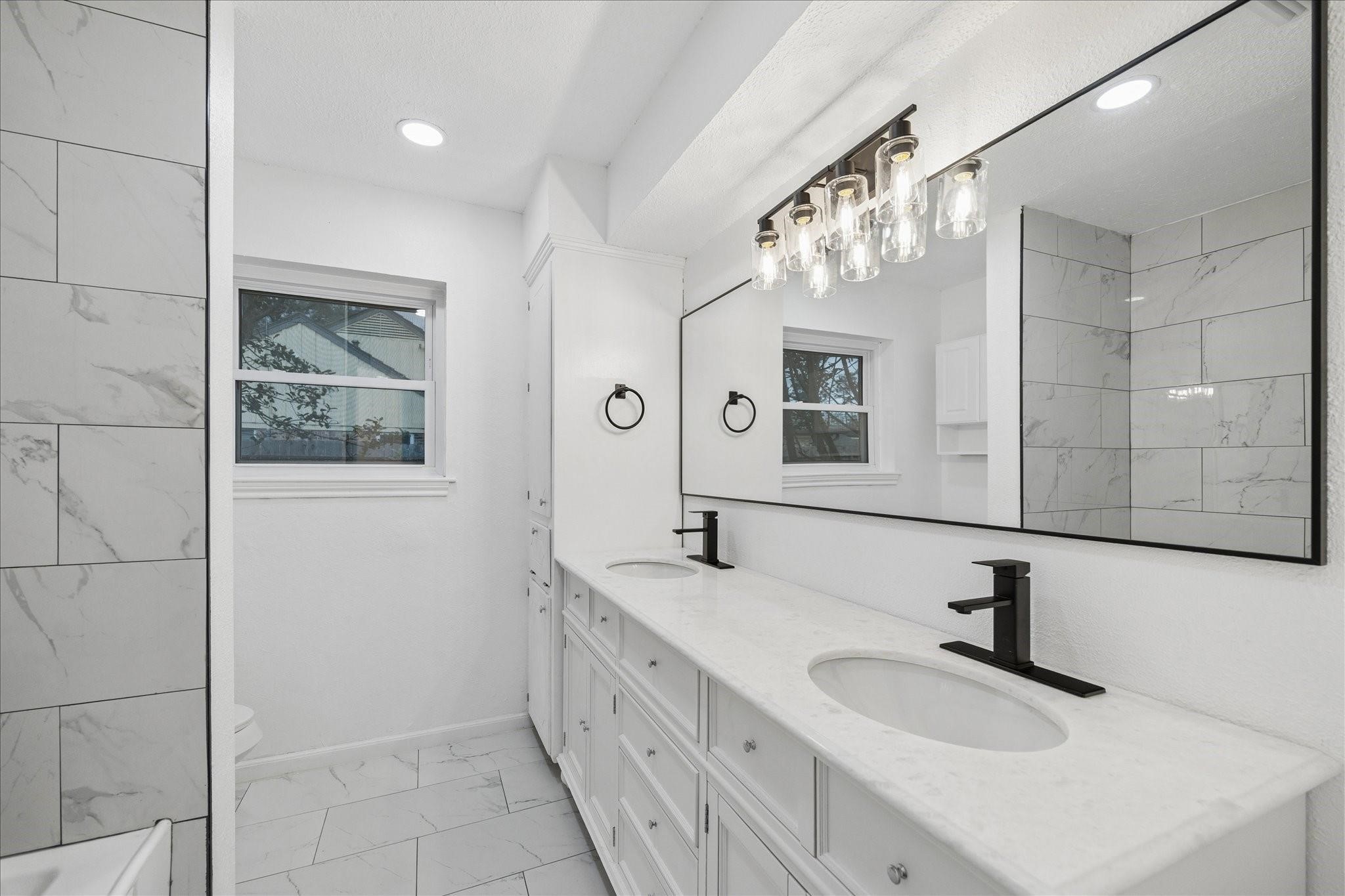 210 Weeping Oak Lane Spring, TX 77388 - Photo 18 of 20 a bathroom with a double vanity sink mirror and
