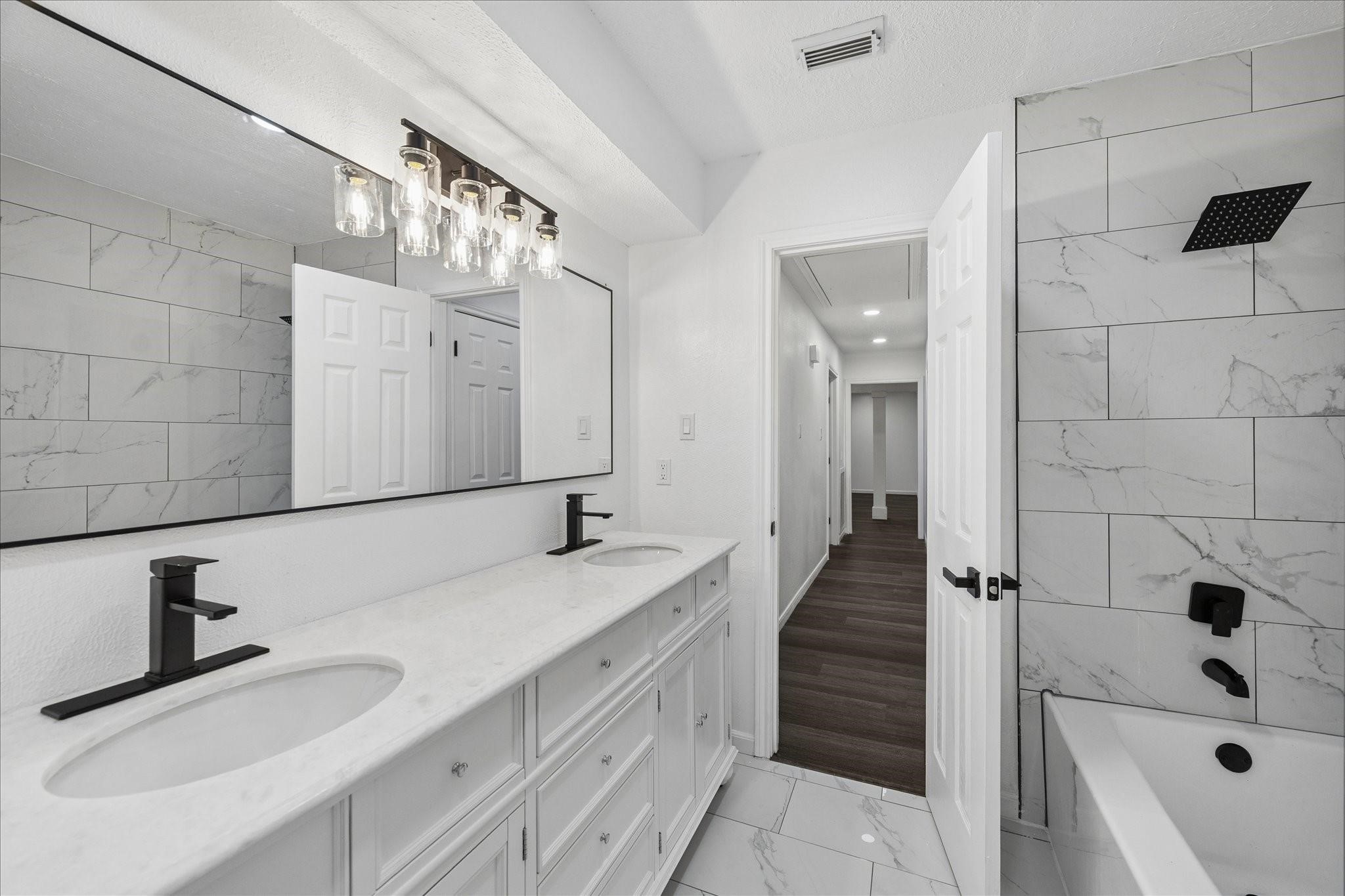 210 Weeping Oak Lane Spring, TX 77388 - Photo 19 of 20 a bathroom with a tub sink and mirror