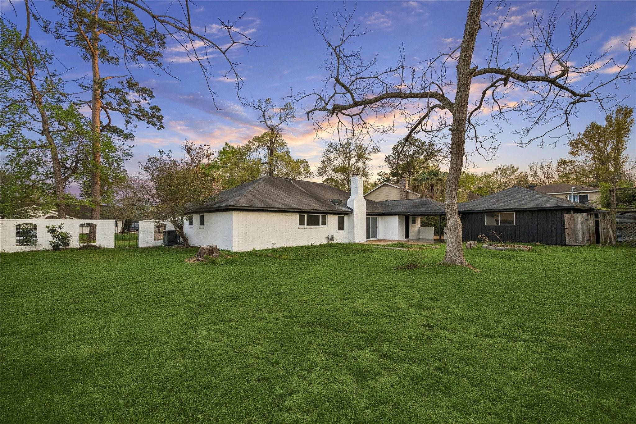 210 Weeping Oak Lane Spring, TX 77388 - Photo 2 of 20 a view of a big yard next to a house