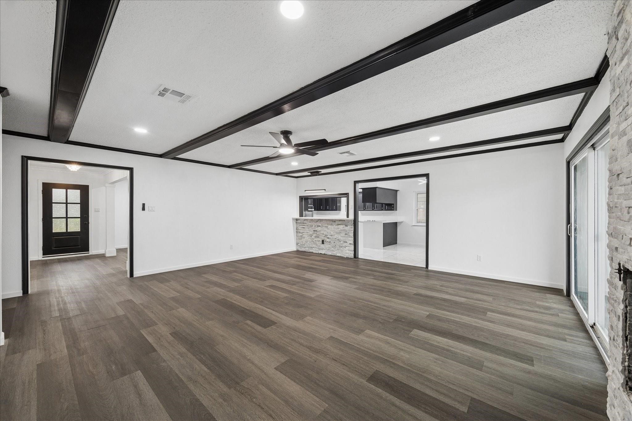 210 Weeping Oak Lane Spring, TX 77388 - Photo 3 of 20 a view of an empty room with wooden floor and windows