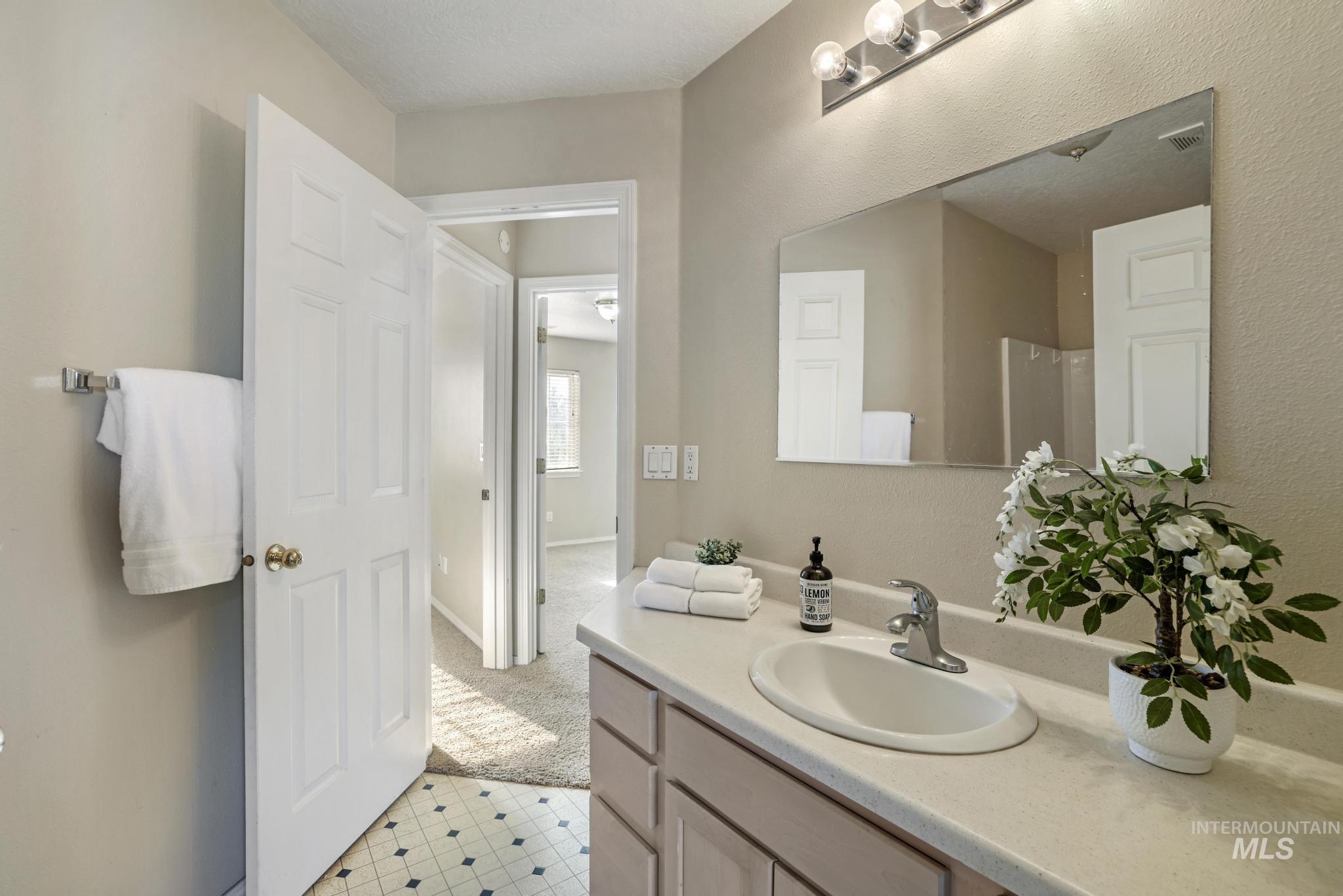 1935 Hampton Way Twin Falls, ID 83301 - Photo 20 of 25 Bathroom with light carpet and vanity