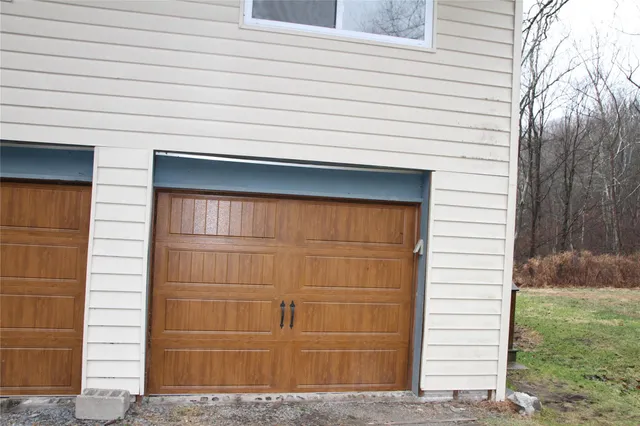 a view of a house with a garage