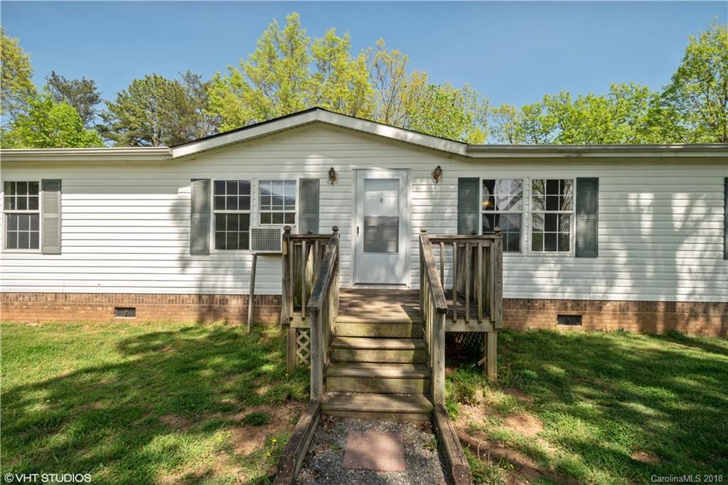 662 Lake Adger Road Mill Spring, NC 28756 - Photo 20 of 20 a front view of a house with a yard