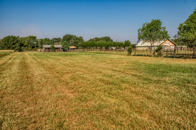 a view of a lake with houses in the background