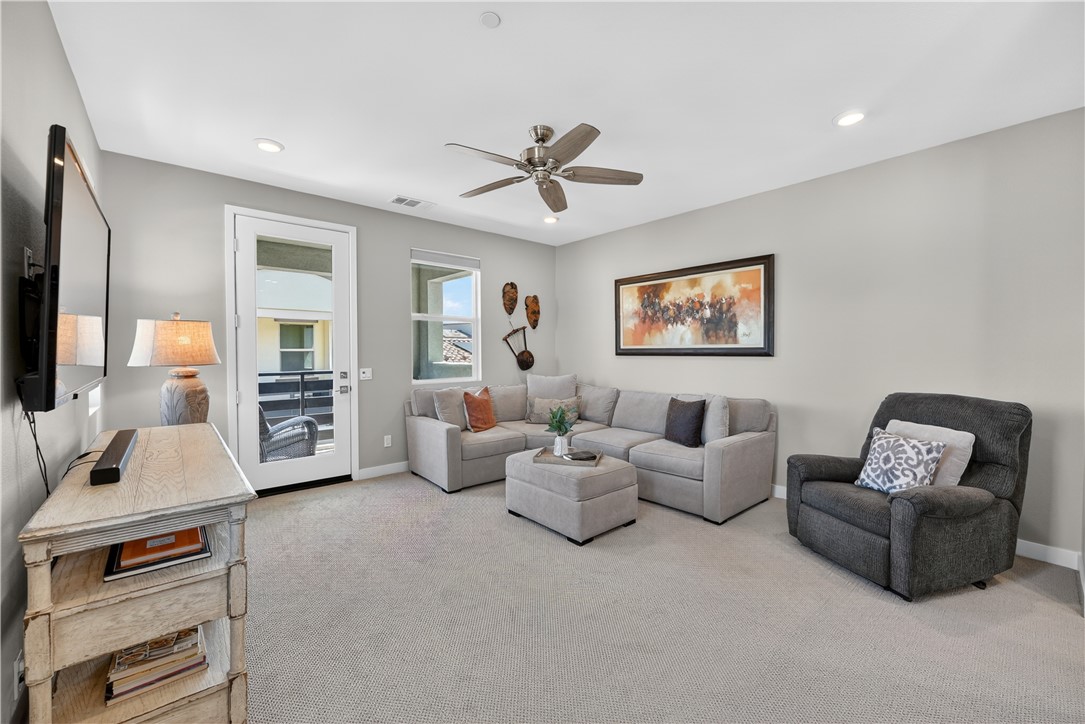 752 Sunrise Road Rancho Mission Viejo, CA 92694 - Photo 28 of 73 a living room with furniture and a flat screen tv