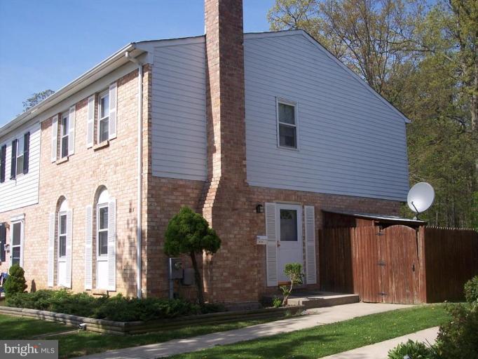 815 Corktree Road, Unit 815 Middle River, MD 21220 - Photo 1 of 13 a front view of a house with a yard and garage