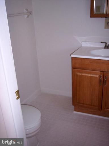 815 Corktree Road, Unit 815 Middle River, MD 21220 - Photo 11 of 13 a bathroom with a sink and toilet