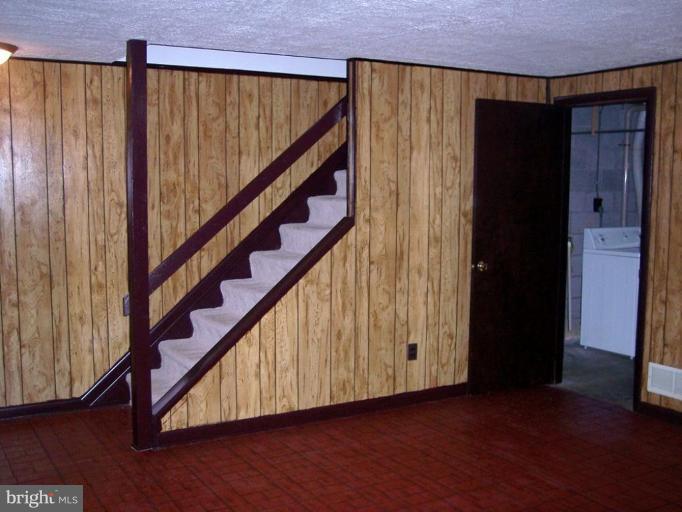 815 Corktree Road, Unit 815 Middle River, MD 21220 - Photo 12 of 13 a view of entryway with wooden floor and stairs