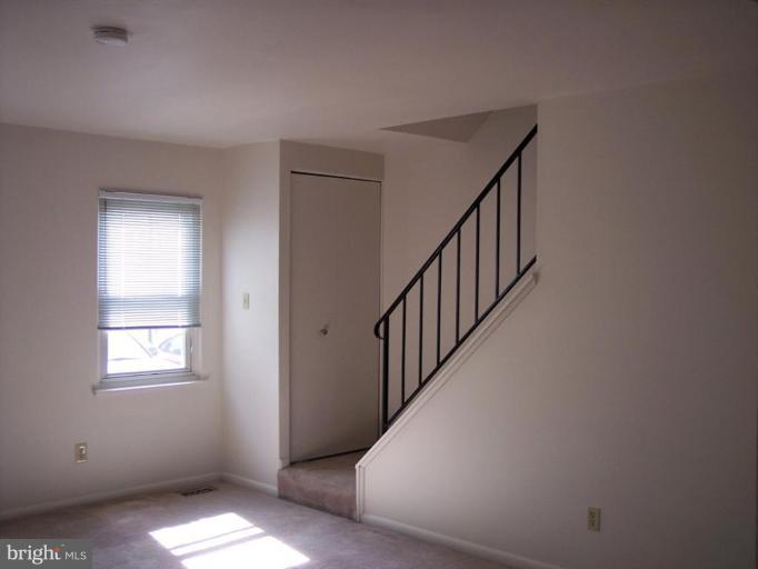 815 Corktree Road, Unit 815 Middle River, MD 21220 - Photo 4 of 13 a view of hallway with windows
