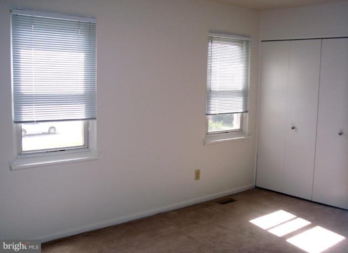 815 Corktree Road, Unit 815 Middle River, MD 21220 - Photo 9 of 13 an empty room with windows