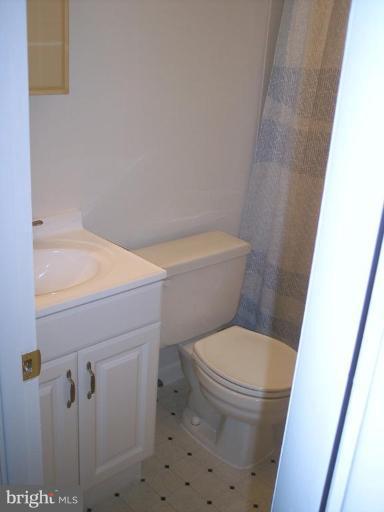 815 Corktree Road, Unit 815 Middle River, MD 21220 - Photo 10 of 13 a white toilet sitting next to a shower