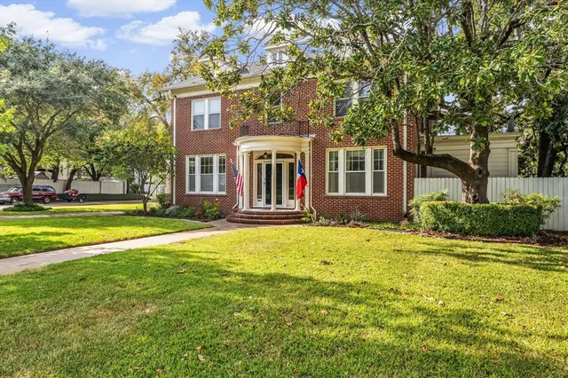 front view of a house with a big yard