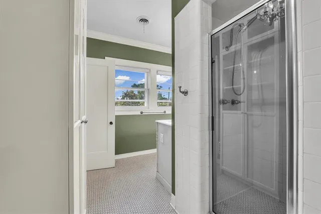 a view of a bathroom from a hallway