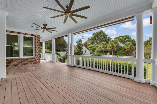 a building outdoor space with patio furniture and potted plants