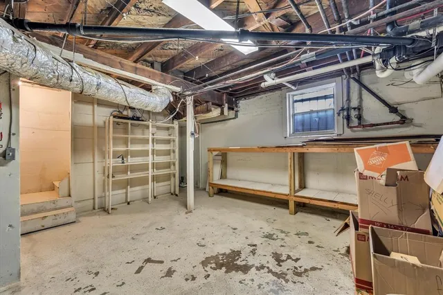 an aerial view of a house with a garden and a yard