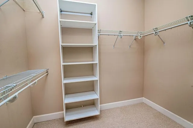 a view of an empty walk in closet