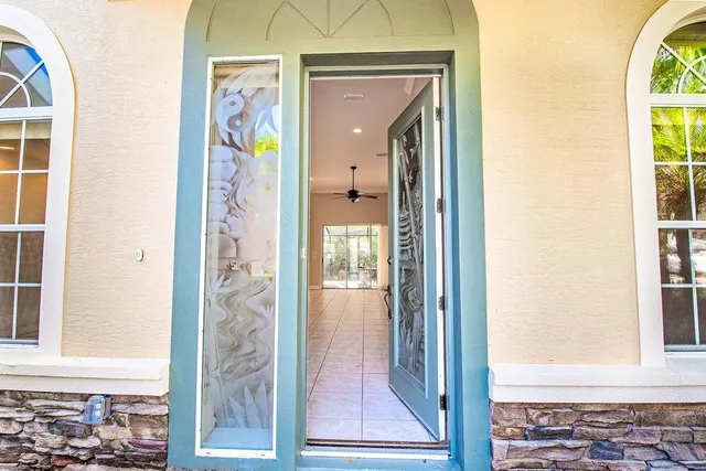 a view of a hallway with wooden floor and a dining room