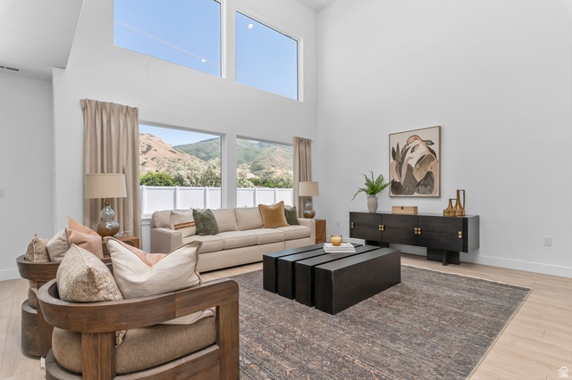 1352 West 2350 South, Unit 18 Perry, UT 84302 - Photo 5 of 26 Expansive living space featuring soaring ceilings and abundant natural light from large windows
