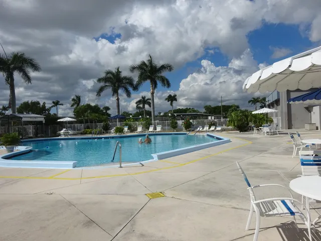 a view of a swimming pool with a patio