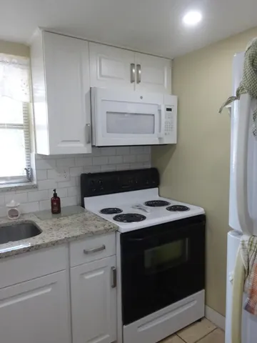 a kitchen with a stove and a sink