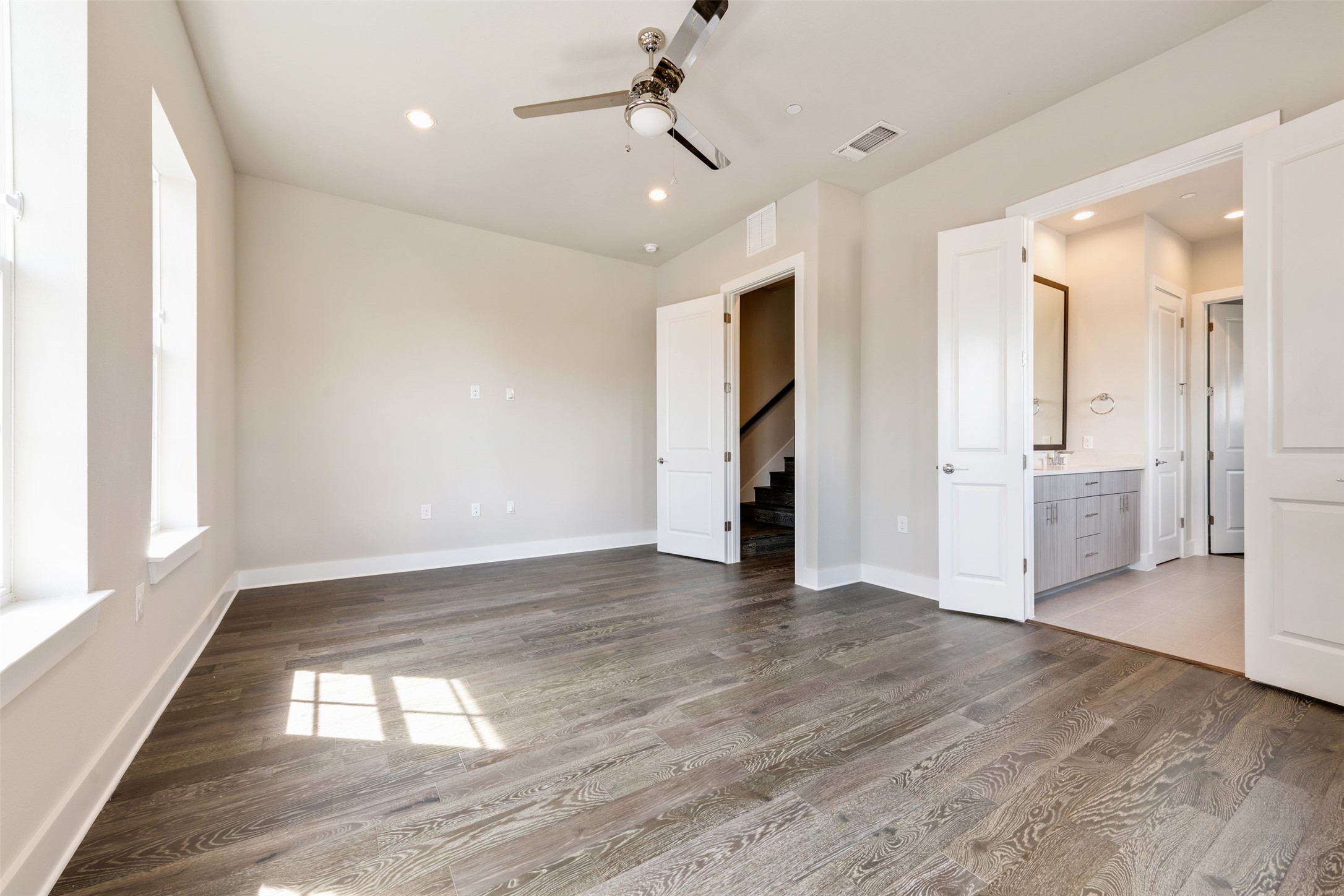1308 Tinnin Ford Road, Unit 1 Austin, TX 78741 - Photo 10 of 21 a view of empty room with wooden floor and windows